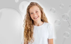 Smiling teen with clear skin after acne treatments.